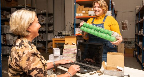 Two colleagues chatting in the warehouse