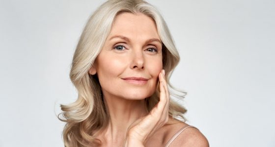 Woman checking the smoothness of her skin