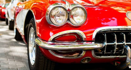 Close up of classic red car headlights