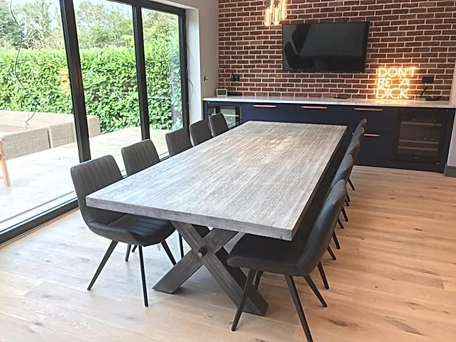 Ennis & Brown custom table in kitchen surround by chairs